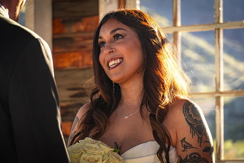 Bride smiling inside the chapel at Nelson Ghost Town