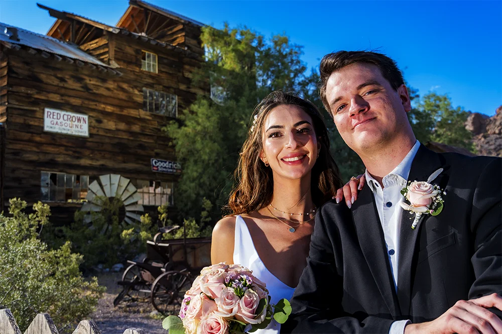 Wedding couple at the wooden fence at Nelson Ghost Town