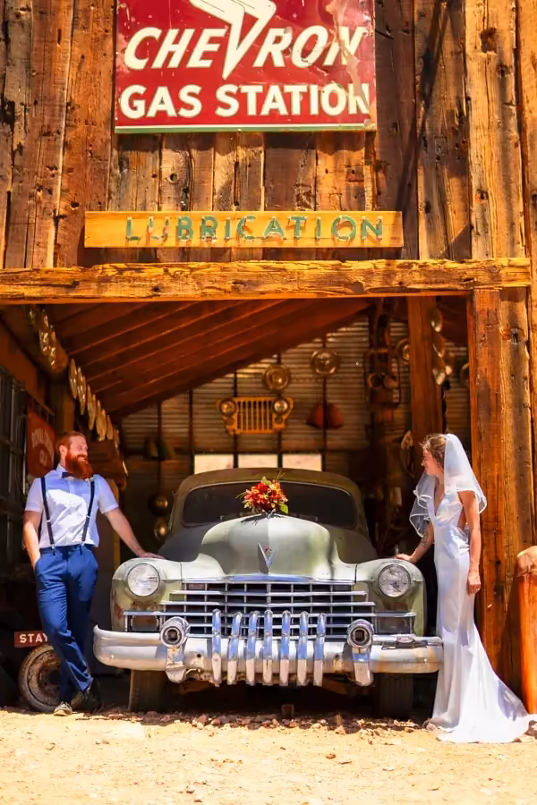 Weathered historic buildings and a vintage Chevron sign at Nelson Ghost Town line the floor of Eldorado Canyon, Nevada